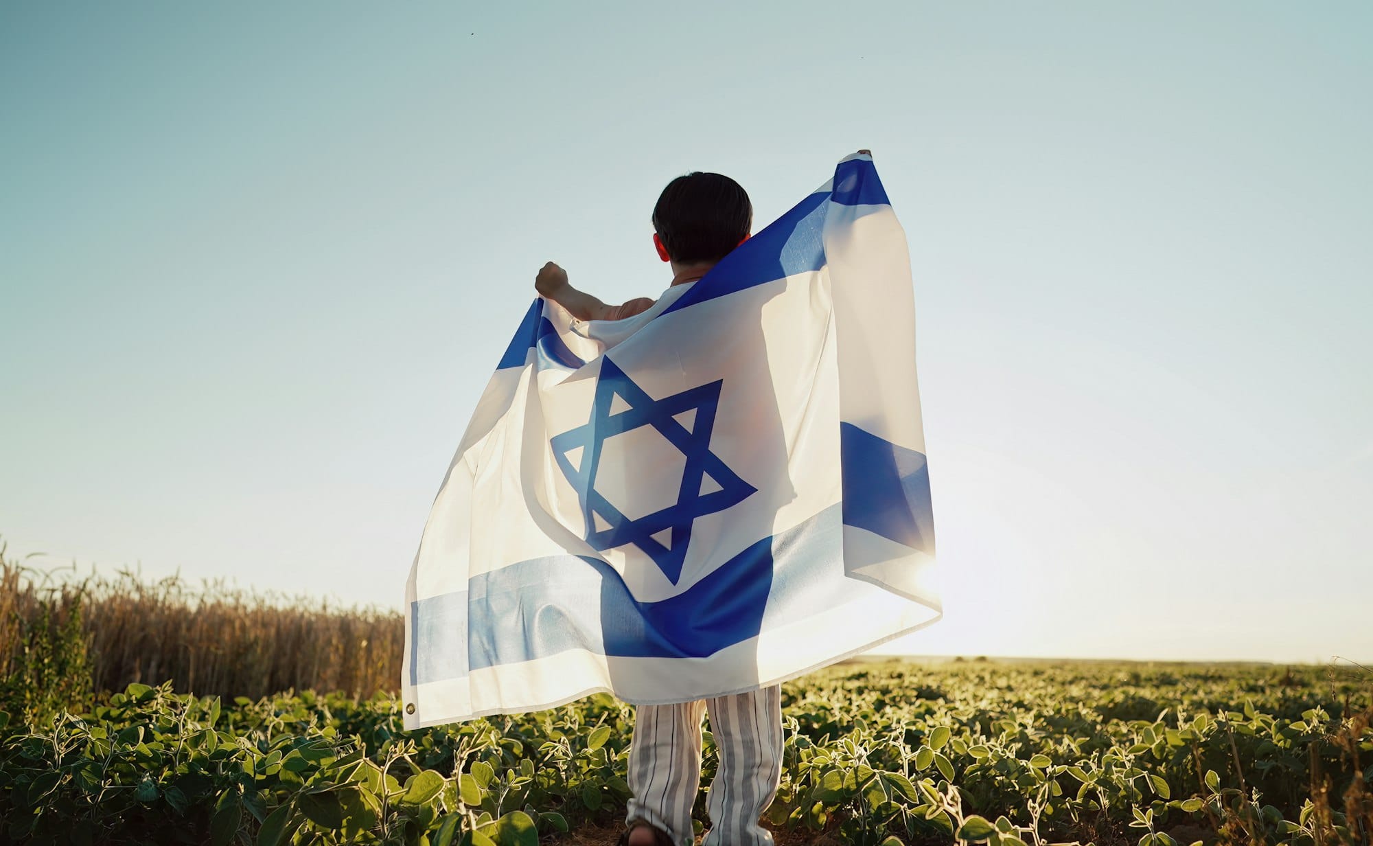 Happy Israeli Jewish Little Boy Jumping, Israel National Flag. Independence Day